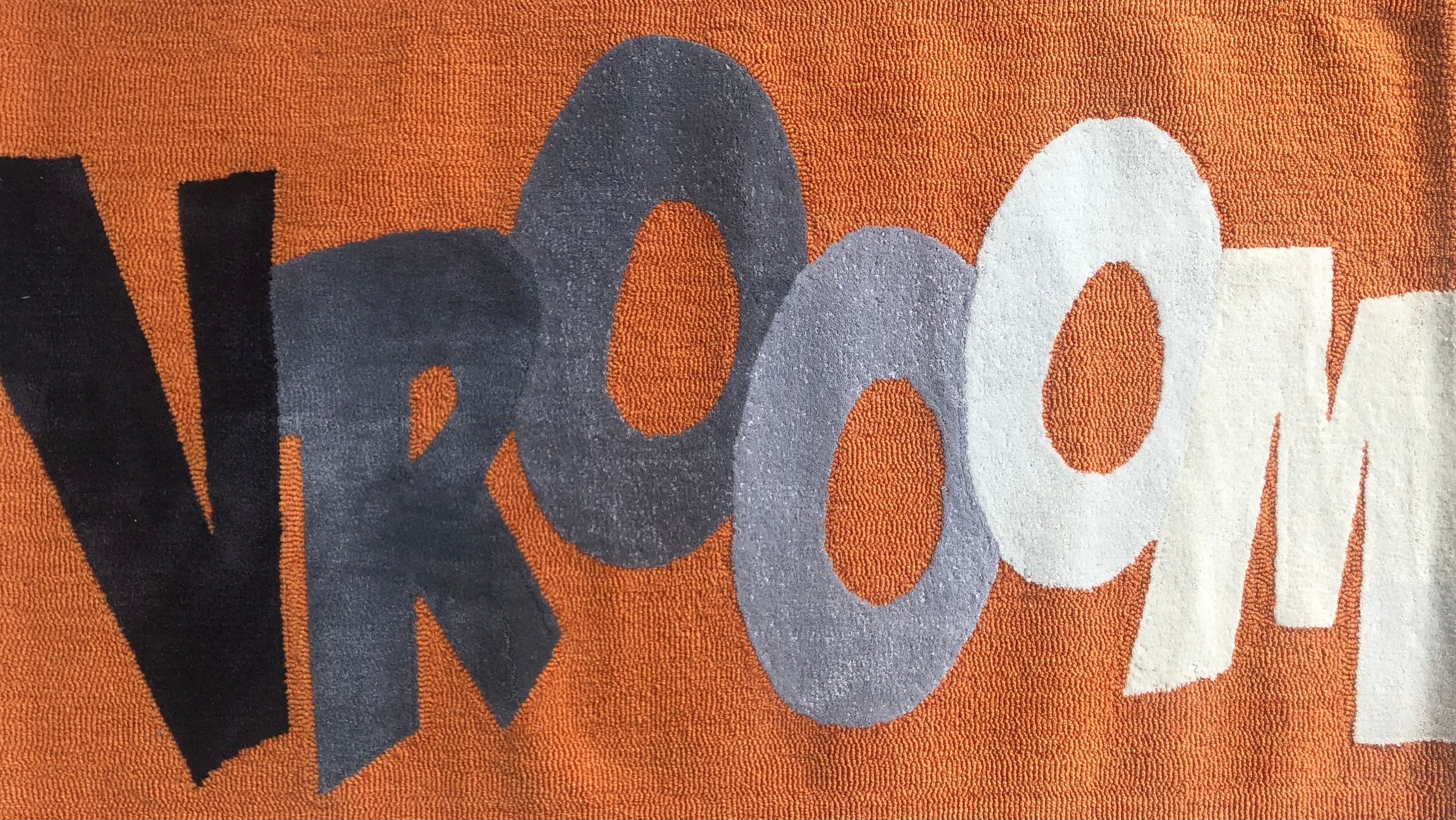 Modern Orange Area Rug with Bold Text Graphic for Indoor Spaces